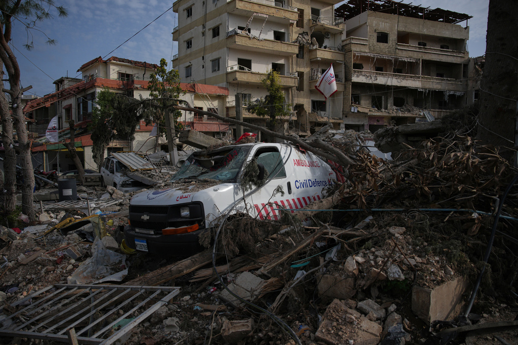 An ambulance belonging to Hezbollah's health unit lies amid the rubble of a medical center destroyed in an Israeli airstrike in Jibchit, southern Lebanon, Friday, April 17, 2026. (AP Photo/Hassan Ammar)