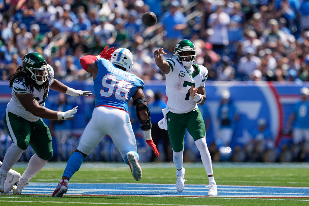 New York Jets quarterback Geno Smith (7) passes over Tennessee Titans defensive tackle Jeffery Simmons (98) during the first half of an NFL football game Sunday, Sept. 13, 2026, in Nashville, Tenn. (AP Photo/George Walker IV)