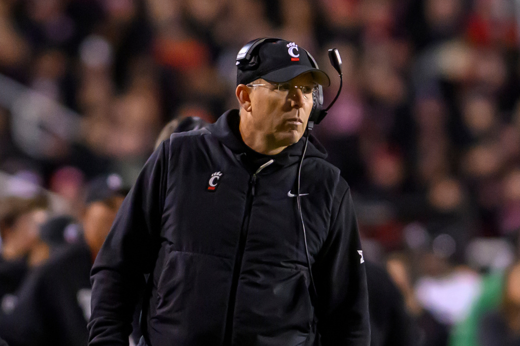FILE - Cincinnati head coach Scott Satterfield looks on from the sidelines during the second half an NCAA college football game against Utah, Nov. 1, 2025, in Salt Lake City, Utah. (AP Photo/Tyler Tate, File)