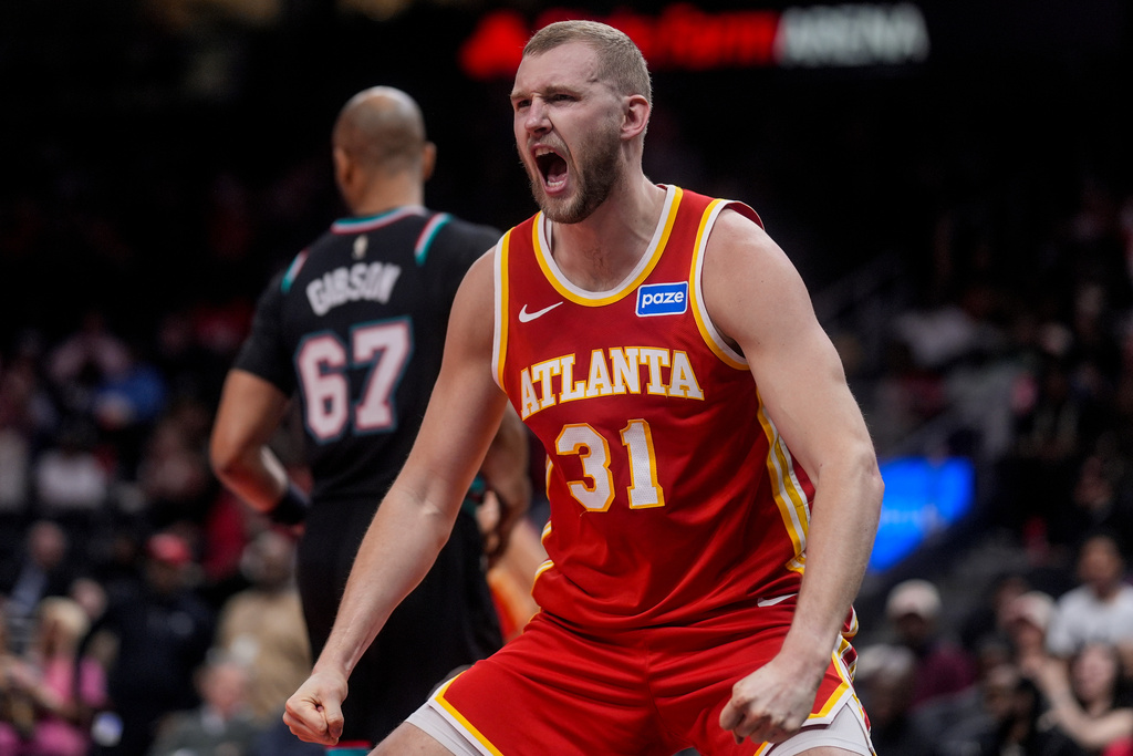 Atlanta Hawks center Jock Landale (31) celebrates his dunk against the Memphis Grizzlies during the first half of an NBA basketball game, Monday, March 23, 2026, in Atlanta. (AP Photo/Mike Stewart)