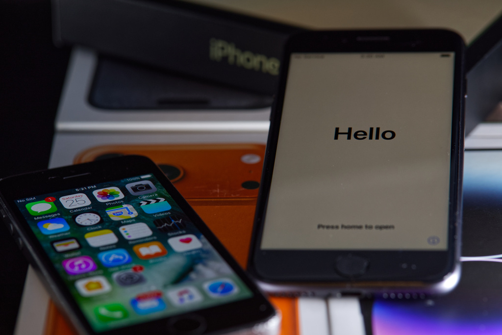 Older iPhone models sit on top of empty boxes of newer iPhones in Phoenix, Tuesday, May 12, 2026. (AP Photo/Dario Lopez-Mills)