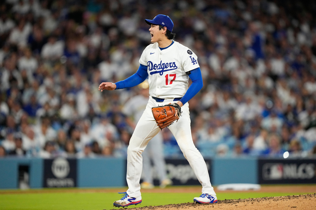 Los Angeles Dodgers pitcher Shohei Ohtani reacts during the fifth inning in Game 4 of baseball's National League Championship Series against the Milwaukee Brewers, Friday, Oct. 17, 2025, in Los Angeles. (AP Photo/Brynn Anderson)
