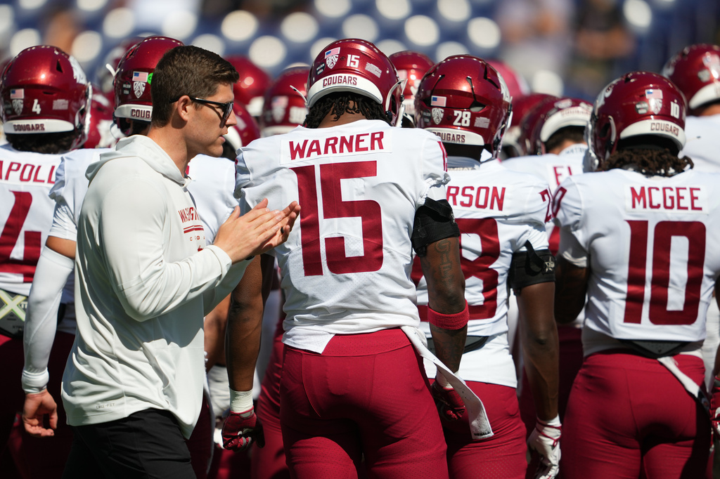 Washington State head coach Kirby Moore claps before an NCAA college football game against Washington, Sunday, Sept. 6, 2026, in Seattle. (AP Photo/Lindsey Wasson)