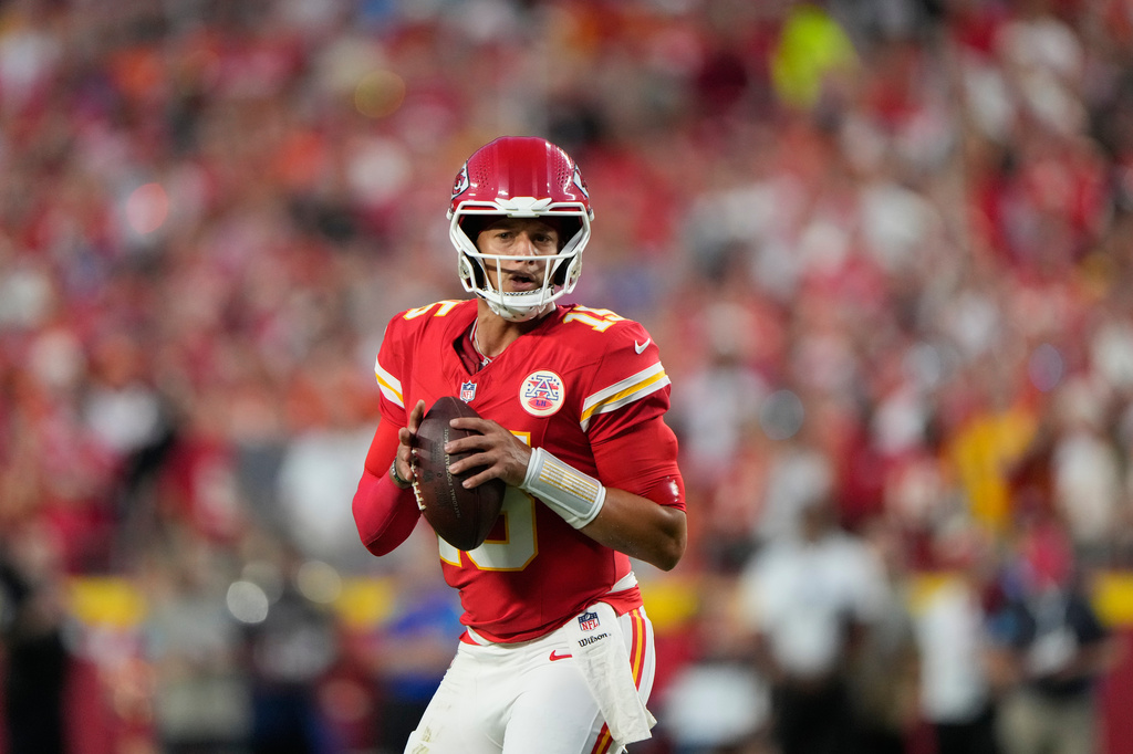 Kansas City Chiefs quarterback Patrick Mahomes looks to pass against the Denver Broncos during the first half of an NFL football game Monday, Sept. 14, 2026, in Kansas City, Mo. (AP Photo/Charlie Riedel)