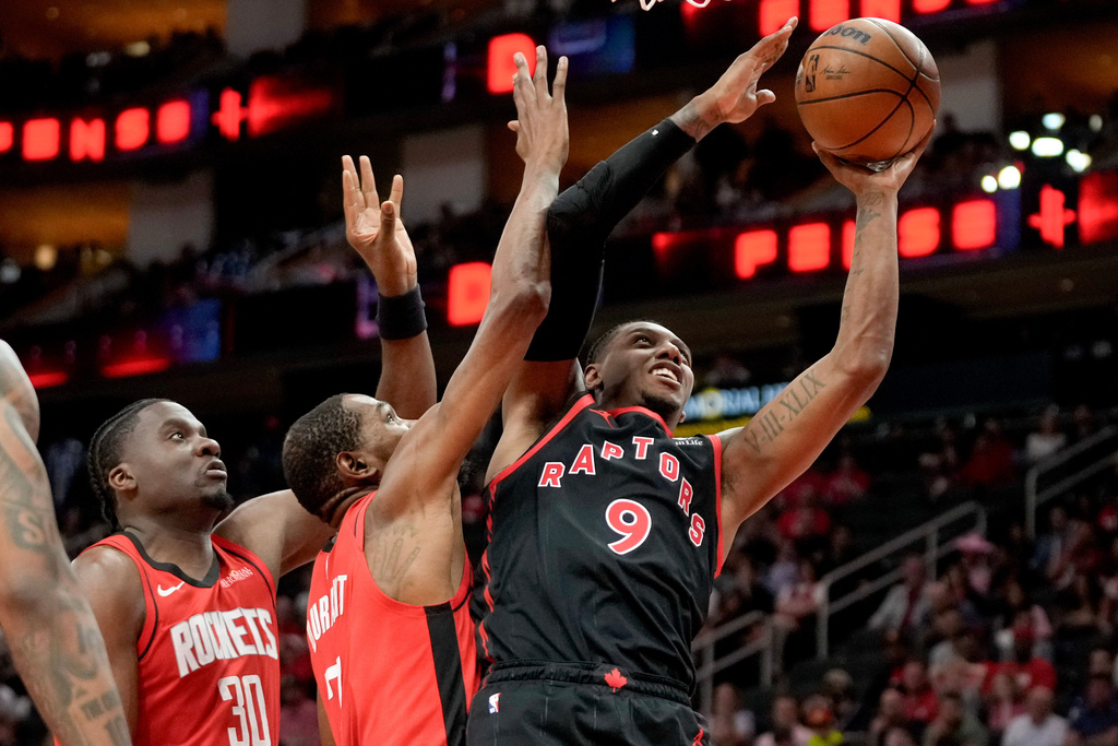 Toronto Raptors forward RJ Barrett (9) shoots as Houston Rockets forward Kevin Durant, left, defends during the second half of an NBA basketball game, Tuesday, March 10, 2026, in Houston. (AP Photo/Eric Christian Smith)