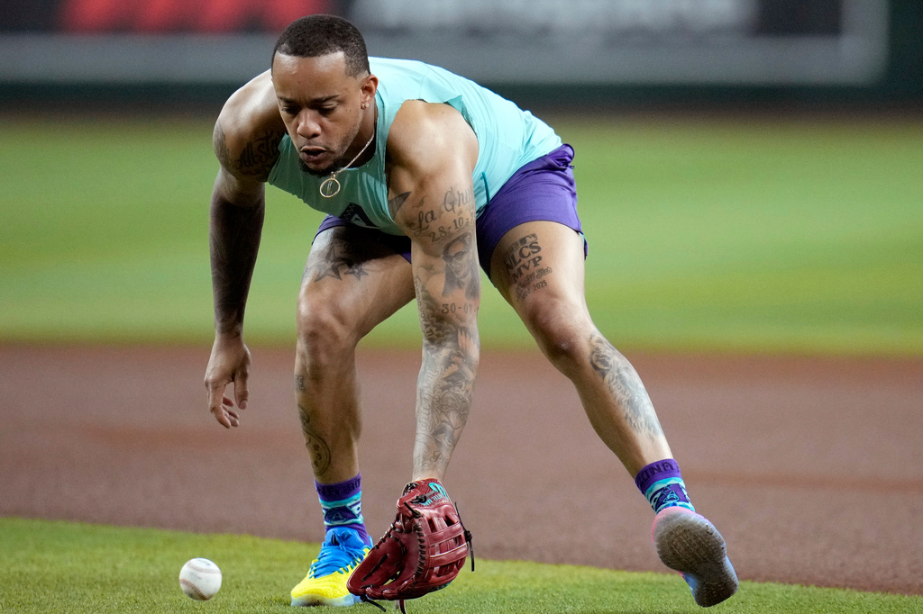 Returning Arizona Diamondbacks' Ketel Marte takes early infield practice prior to a baseball game against the Philadelphia Phillies, Monday, Aug. 31, 2026, in Phoenix. (AP Photo/Ross D. Franklin)