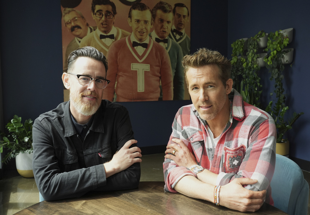 Colin Hanks, left, director of the documentary film "John Candy: I Like Me," poses with producer Ryan Reynolds for a portrait at The Second City comedy club to promote the film during the Toronto International Film Festival on Thursday, Sept. 4, 2025, in Toronto. (AP Photo/Chris Pizzello)