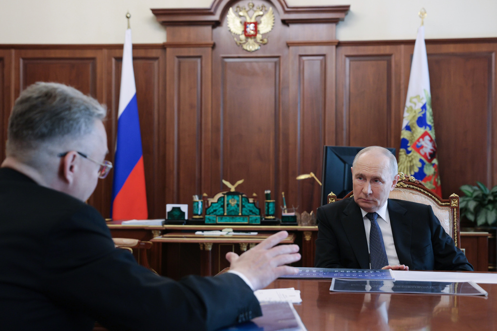 Russian President Vladimir Putin, right, listens to Stavropol region governor Vladimir Vladimirov during their meeting at the Kremlin in Moscow, Tuesday, Aug. 25, 2026. (Mikhail Metzel/Sputnik, Kremlin Pool Photo via AP)