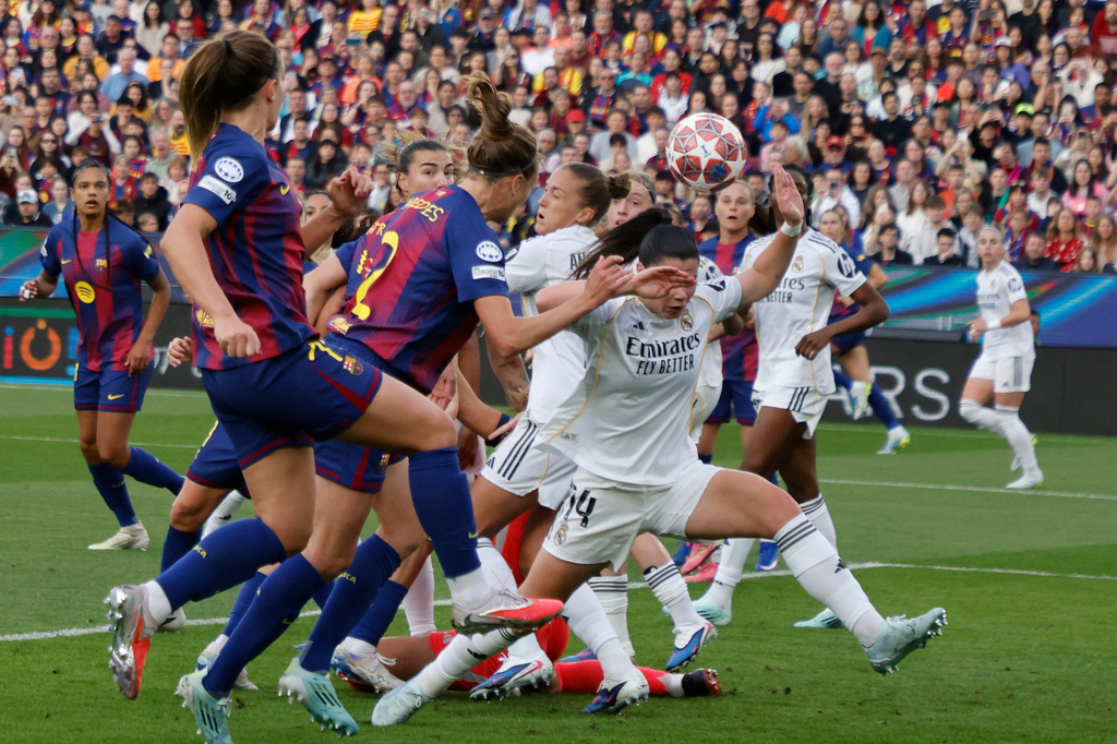Barcelona's Irene Paredes heads the ball to score her side's third goal during a Champions League quarterfinal soccer match between Barcelona and Real Madrid, in Barcelona, Spain, Thursday, April 2 2026. (AP Photo/Joan Monfort)