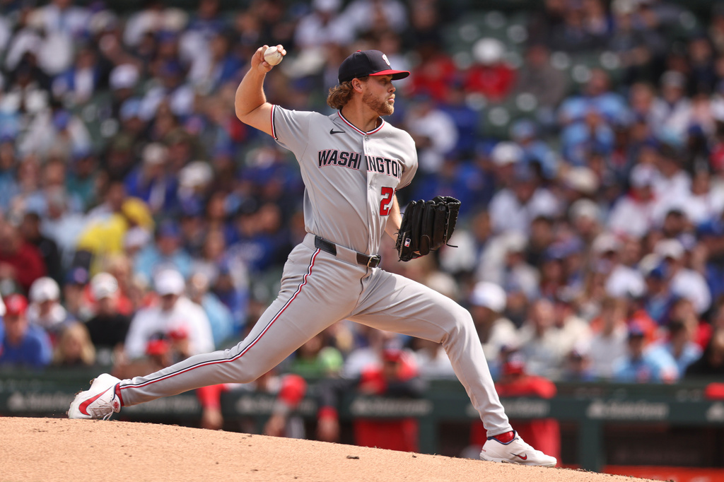 Washington Nationals Jake Irvin (27) pitches the ball during the third inning of a baseball game against the Chicago Cubs at Wrigley Field on Sunday, March 29, 2026, in Chicago. (AP Photo/Geoff Stellfox)