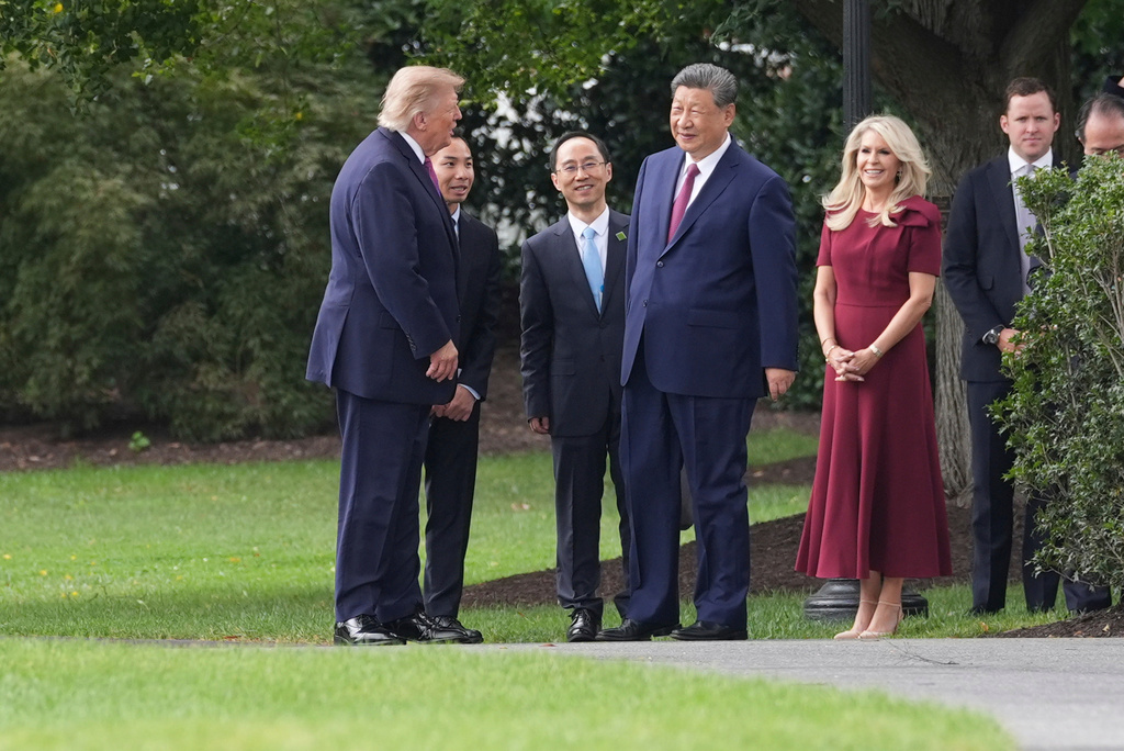 President Donald Trump, left, speaks with China's President Xi Jinping on the South Lawn of the White House, Thursday, Sept. 24, 2026, in Washington. (AP Photo/Alex Brandon)