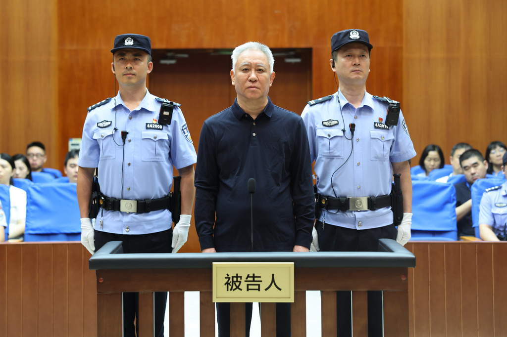 In this handout photo released by Xinhua News Agency, Hui Ka Yan, also known as Xu Jiayin, founder of property developer Evergrande stands trial at the Shenzhen Intermediate People's Court in Shenzhen, south China's Guangdong Province, Thursday, Aug. 20, 2026. (Shenzhen Intermediate People's Court/Xinhua via AP)