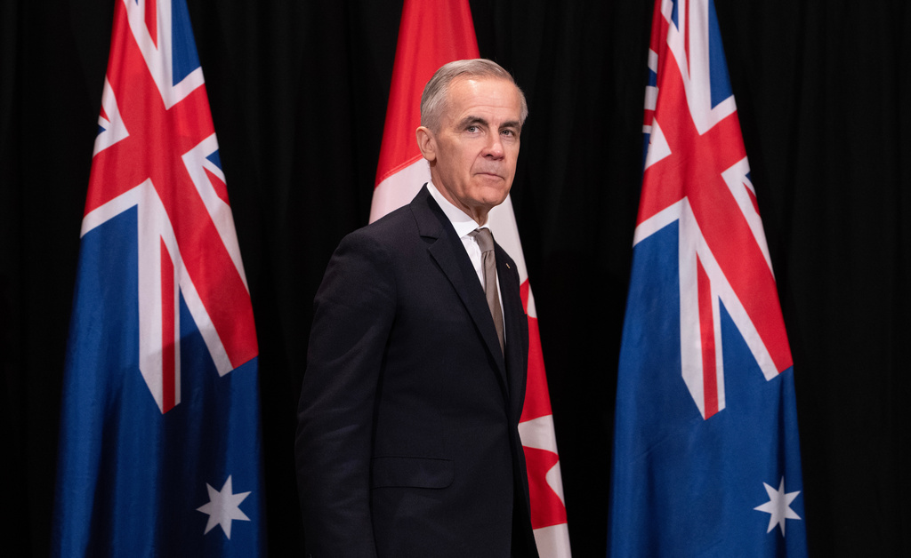 canada's Prime Minister Mark Carney takes his place for a signing ceremony, in Sydney, Australia, on Wednesday, March 4, 2026. (Adrian Wyld/The Canadian Press via AP)