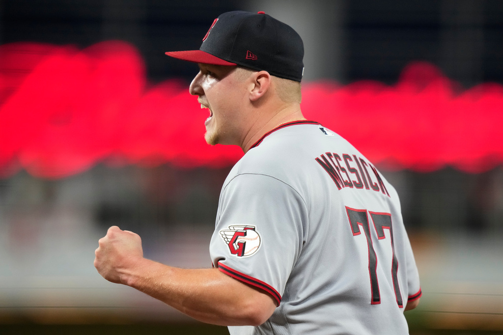 Cleveland Guardians starting pitcher Parker Messick (77) reacts after Miami Marlins' Joe Mack was out a first on a ground out during the fifth inning of a baseball game, Friday, July 10, 2026, in Miami. (AP Photo/Lynne Sladky)