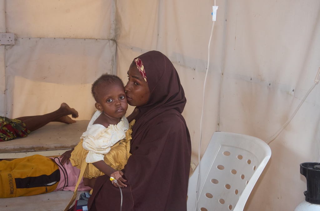 A mother holds her child suffering from cholera at the MSF treatment centre in Maiduguri, Nigeria. Monday, June 8, 2026. (AP Photo/Jude Mike)