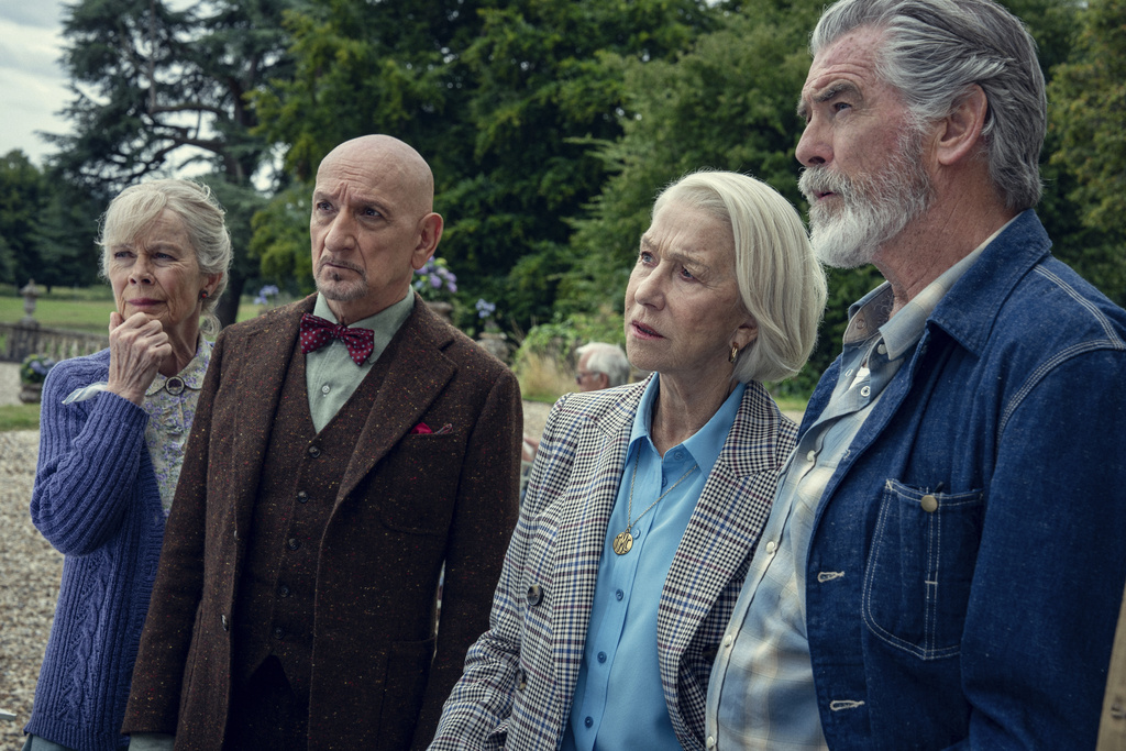 This image released by Netflix shows, from left, Celia Imrie, Ben Kingsley, Helen Mirren, and Pierce Brosnan in a scene from "The Thursday Murder Club." (Netflix via AP)