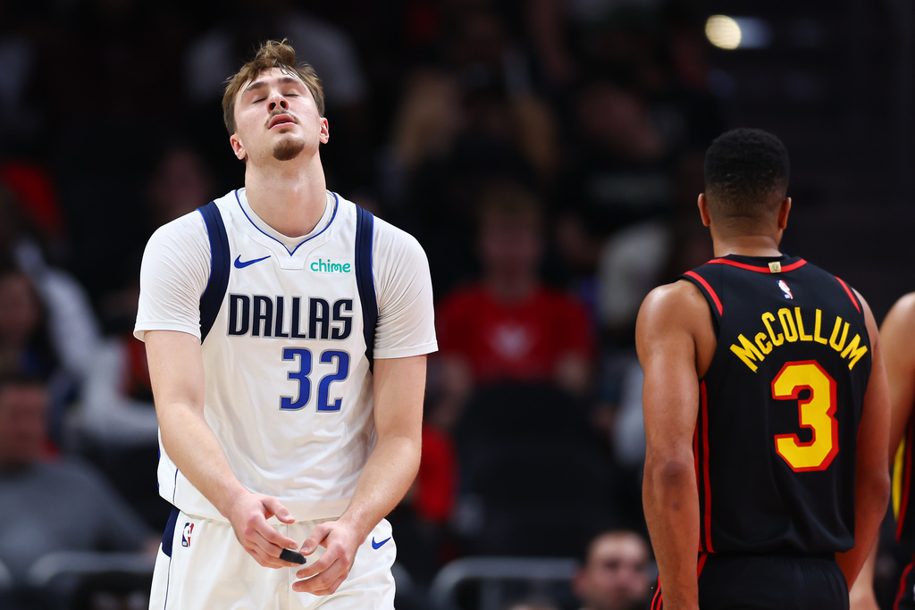 Dallas Mavericks forward Cooper Flagg (32) reacts during the first half of an NBA basketball game against the Atlanta Hawks, Tuesday, March 10, 2026, in Atlanta. (AP Photo/Colin Hubbard)