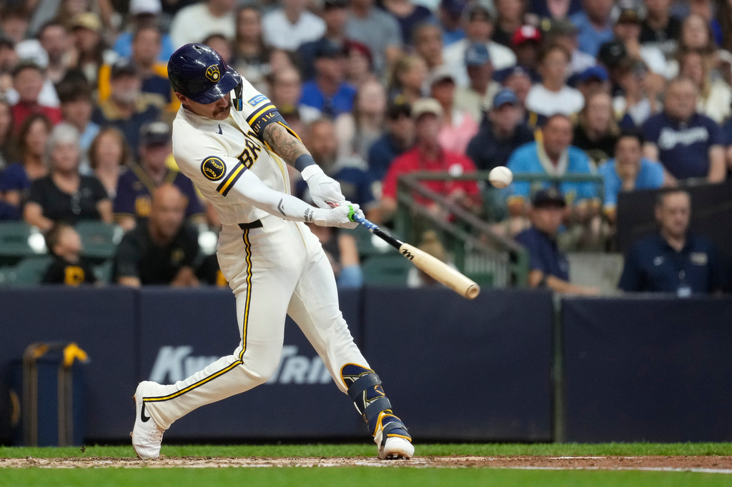 Milwaukee Brewers' Joey Ortiz hits an RBI single during the fifth inning of a baseball game against the Pittsburgh Pirates, Monday, Aug. 3, 2026, in Milwaukee. (AP Photo/Aaron Gash)