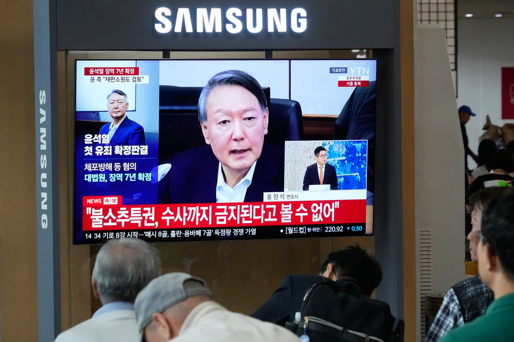 A TV screen shows an image of former South Korea President Yoon Suk Yeol during a news program at the Seoul Railway Station in Seoul, South Korea, Thursday, July 9, 2026. (AP Photo/Ahn Young-joon)