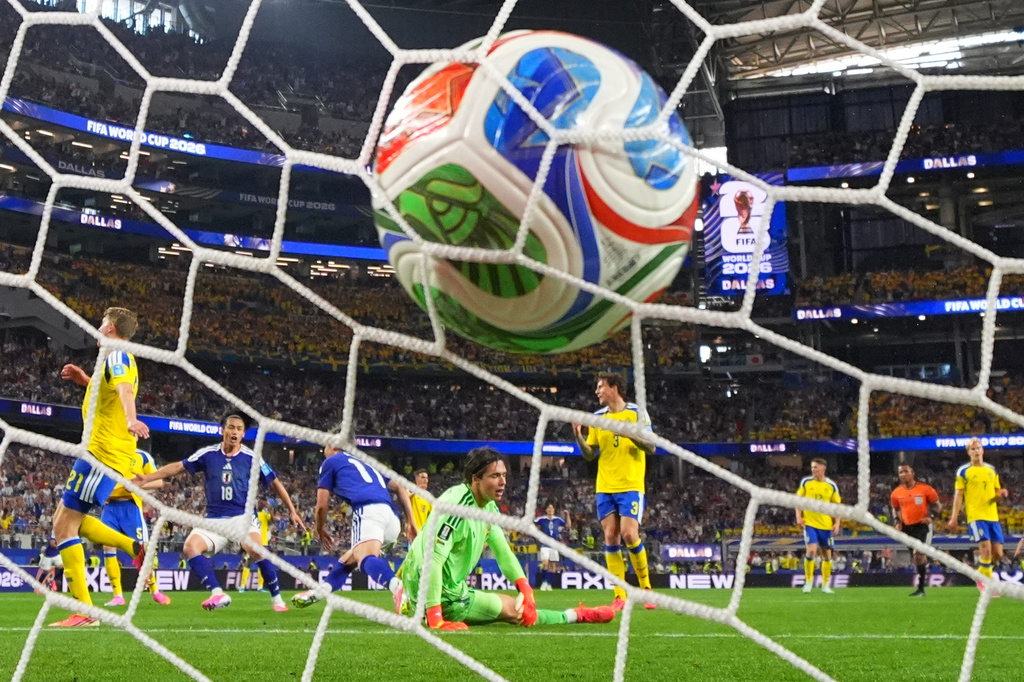 Japan's Daizen Maeda (11) scores their opening goal during the World Cup Group F soccer match between Japan and Sweden in Arlington, Texas, near Dallas, Thursday, June 25, 2026. (AP Photo/Julio Cortez)