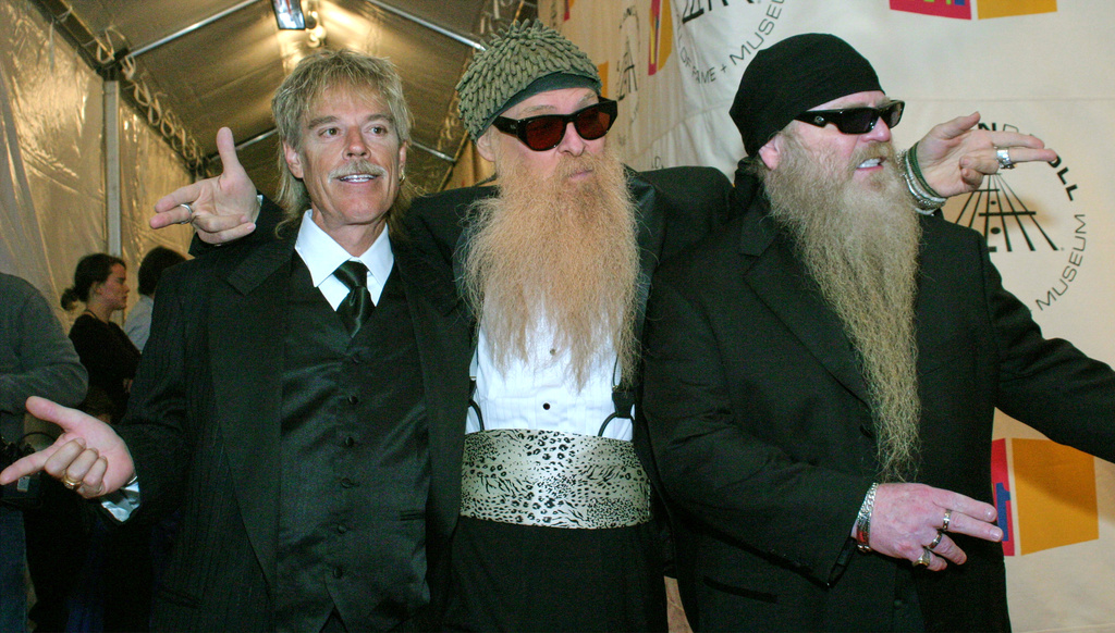 FILE - ZZ Top drummer Frank Beard, from left, lead singer and guitarist Billy F. Gibbons and bass player Dusty Hill appear at the 19th Annual Rock and Roll Hall of Fame induction ceremony in New York on March 15, 2004. (AP Photo/Tina Fineberg, File)