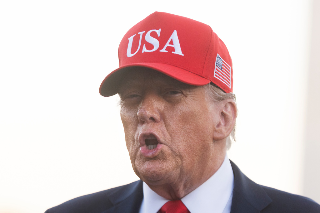 President Donald Trump speaks to reporters upon arrival on the south Lawn at the White House in Washington, Sunday, Oct. 5, 2025. (AP Photo/Manuel Balce Ceneta)