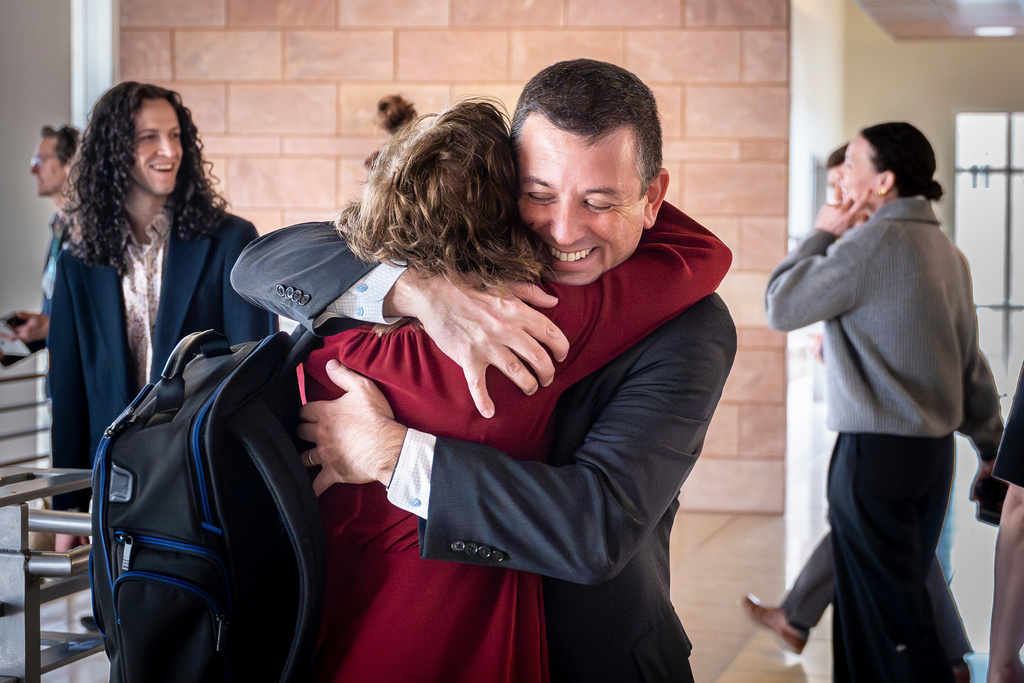 Civil litigator David Ackerman embraces New Mexico state attorney Linda Singer following a landmark verdict where the jury found Meta willfully violated New Mexico's consumer protection laws and are ordered to pay the state $375 million in damages, Tuesday, March 24, 2026 , in Santa Fe, N.M. (Nathan Burton/Santa Fe New Mexican via AP, Pool)
