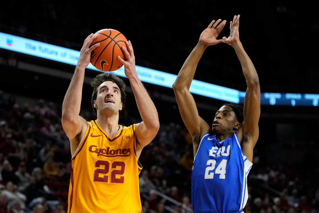 Iowa State forward Milan Momcilovic (22) drives to the basket ahead of Eastern Illinois forward Terry McMorris (24) during the first half of an NCAA college basketball game, Sunday, Dec. 14, 2025, in Ames, Iowa. (AP Photo/Charlie Neibergall)