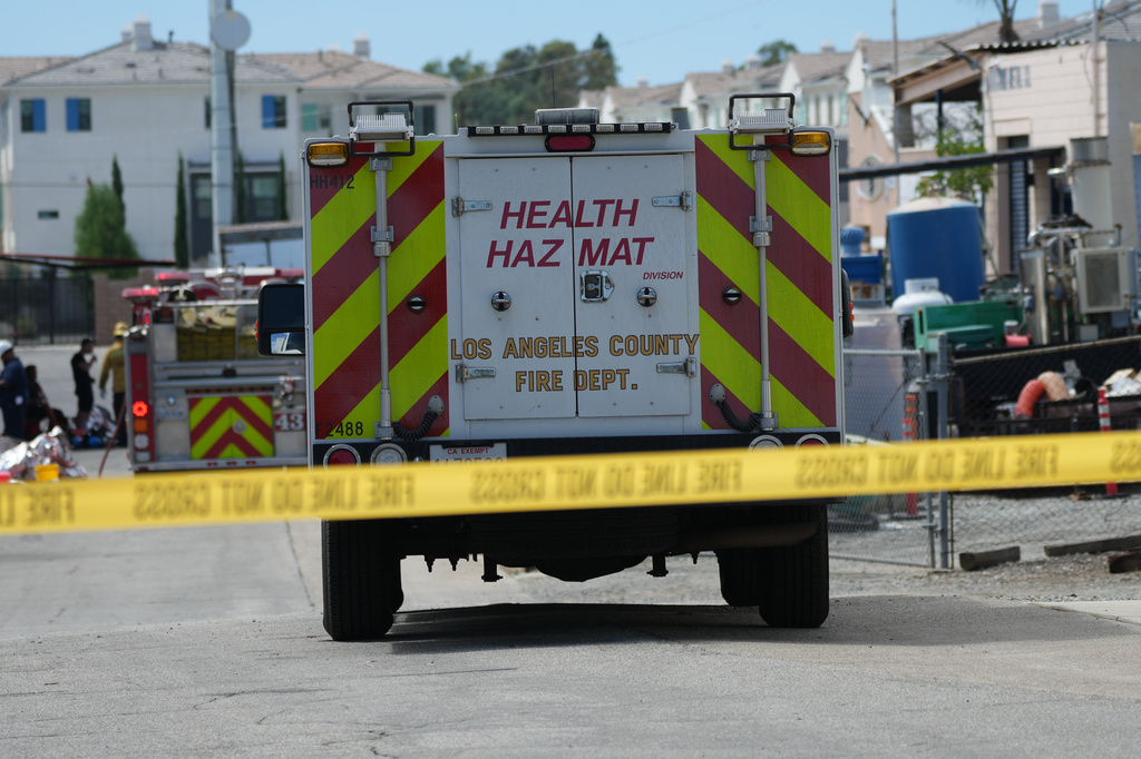 Emergency vehicles line a cordoned off street near a chemical leak Tuesday, Sept. 8, 2026, in La Habra, Calif. (AP Photo/Jae C. Hong)