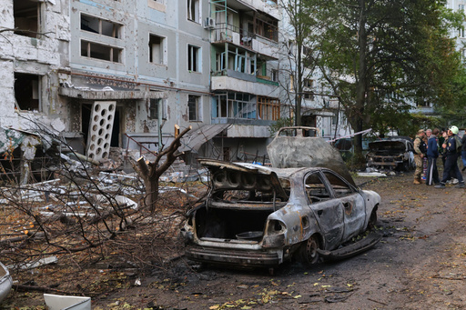 Burned cars and damaged residential building are seen after a Russian strike in Zaporizhzhia, Ukraine, Sunday, Oct. 5, 2025. (AP Photo/Kateryna Klochko) Burned cars and damaged residential building are seen after a Russian strike in Zaporizhzhia, Ukraine, Sunday, Oct. 5, 2025. (AP Photo/Kateryna Klochko)