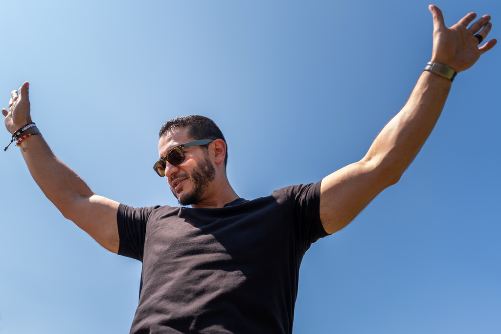 Abdul El-Sayed, a progressive candidate in the Democratic primary for U.S. Senate in Michigan, greets voters at Salina Intermediate School on election day, Tuesday, Aug. 4, 2026, in Dearborn, Mich. (AP Photo/Julia Demaree Nikhinson)