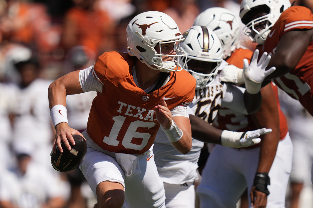 Texas quarterback Arch Manning (16) scrambles against Texas State during the first half of an NCAA college football game in Austin, Texas, Saturday, Sept. 5, 2026. (AP Photo/Eric Gay)