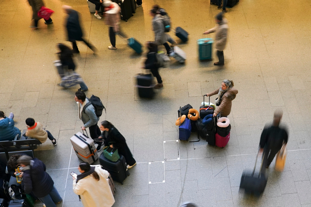 Travellers wait for Eurostar services at St Pancras International station in London, Tuesday, Dec. 30, 2025. (AP Photo/Alberto Pezzali)