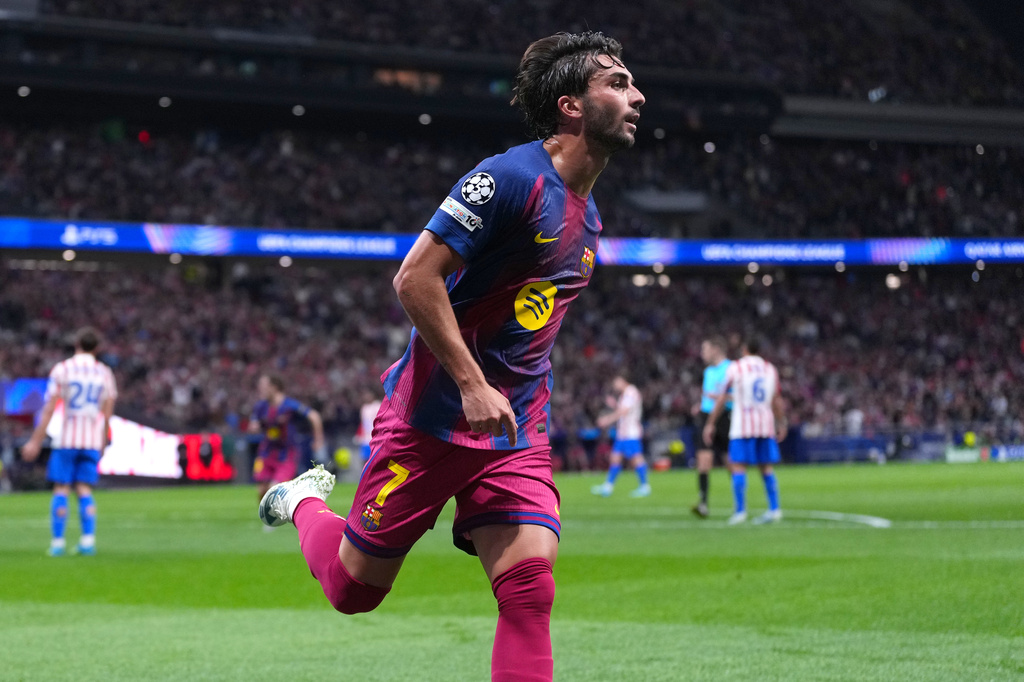 Barcelona's Ferran Torres celebrates after scoring his side's second goal the Champions League quarterfinal second leg soccer match between Atletico Madrid and Barcelona in Madrid, Spain, Tuesday, April 14, 2026. (AP Photo/Manu Fernandez)