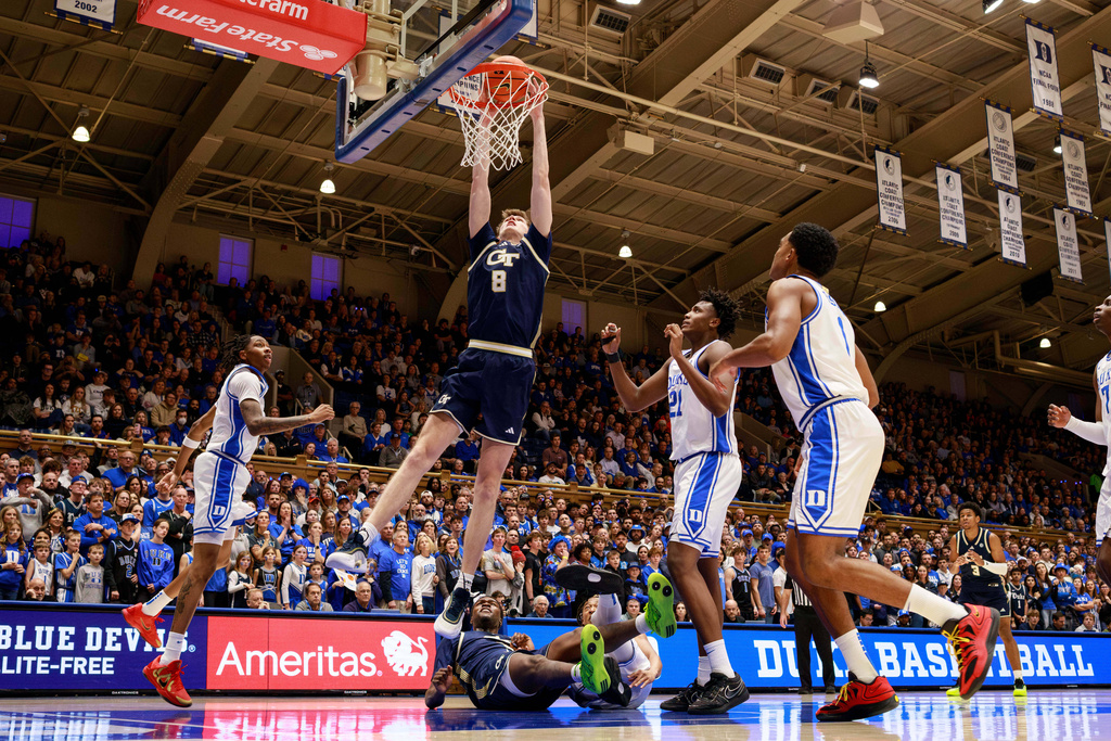 Georgia Tech's Cole Kirouac (8) dunks during the first half of an NCAA college basketball game against Duke in Durham, N.C., Wednesday, Dec. 31, 2025. (AP Photo/Ben McKeown)