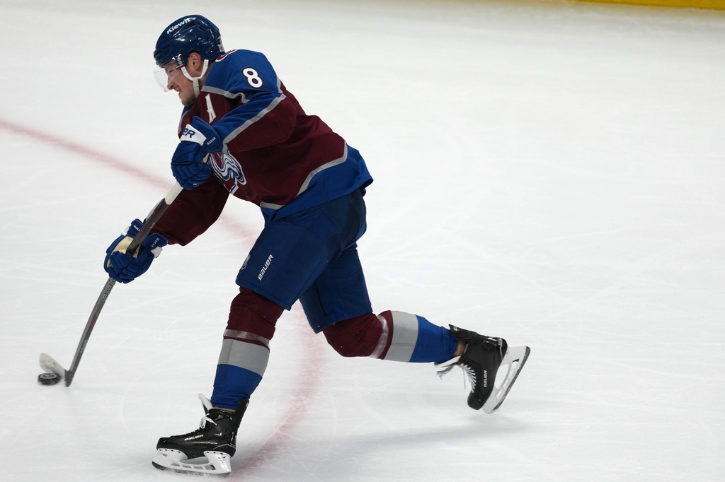 Colorado Avalanche defenseman Cale Makar shoots the puck to score a goal against the Minnesota Wild in the third period of Game 1 of an NHL hockey Stanley Cup second-round playoff series, Sunday, May 3, 2026, in Denver. (AP Photo/David Zalubowski)