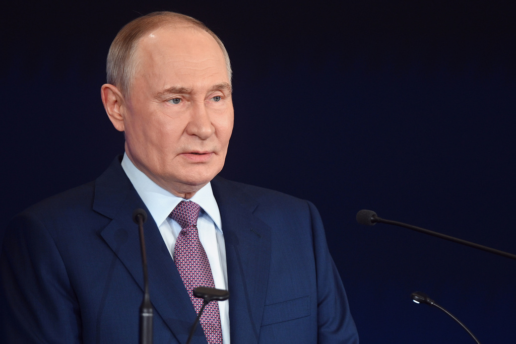 Russian President Vladimir Putin speaks at the Russian Geographical Society congress at the State Kremlin Palace in Moscow, Russia, Thursday, Oct. 23, 2025. (Kristina Kormilitsyna, Sputnik, Kremlin Pool Photo via AP)