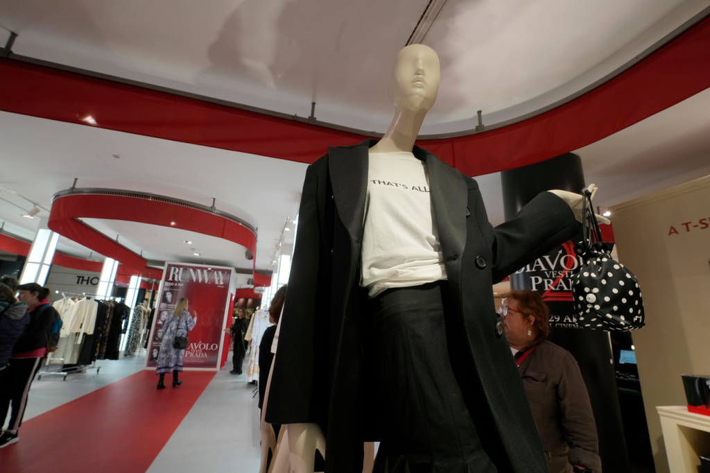 Visitors enjoy an installation of the new movie 'The Devil Wears Prada 2' at La Rinascente shopping center, in Milan, Italy, Monday, April 20, 2026. (AP Photo/Luca Bruno)