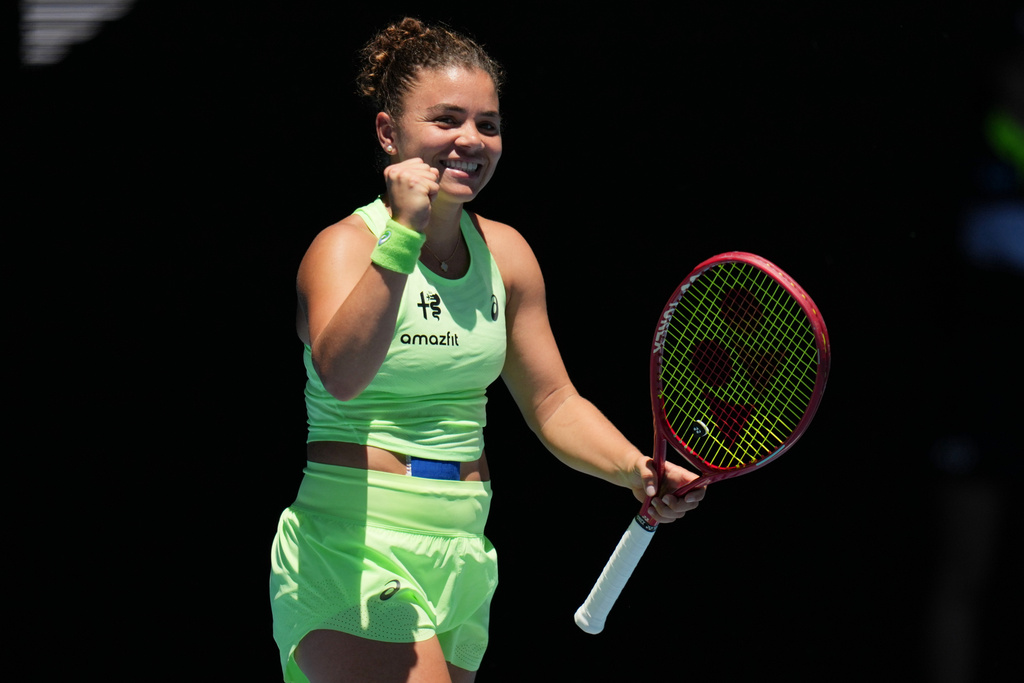 Jasmine Paolini of Italy celebrates after defeating Aliaksandra Sasnovich of Belarus in their first round match at the Australian Open tennis championship in Melbourne, Australia, Sunday, Jan. 18, 2026. (AP Photo/Dita Alangkara)