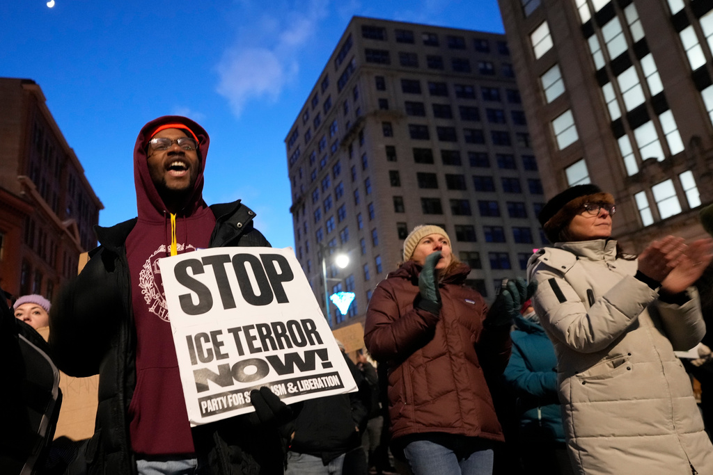 Protesters rally against the presence of U.S. Immigration Customs Enforcement in Maine, Friday, Jan. 23, 2026, in Portland, Maine. (AP Photo/Robert F. Bukaty)