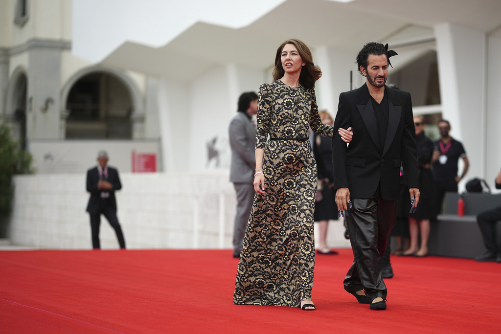 Director Sofia Coppola, left, and designer Marc Jacobs pose for photographers on the red carpet for the film 'Marc by Sofia' during the 82nd edition of the Venice Film Festival in Venice, Italy, on Tuesday, Sept. 2, 2025. (Photo by Alessandra Tarantino/Invision/AP)