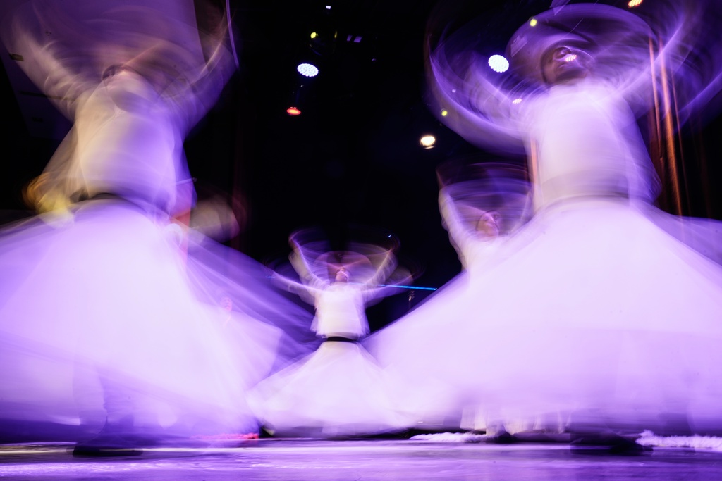 Whirling dervishes of the Mevlevi order perform during a Sheb-i Arus ceremony at a municipality cultural center in Istanbul, Turkey, Wednesday, Dec. 17, 2025, to commemorate the death of 13th century Islamic scholar, poet and Sufi mystic Jalaladdin Rumi.(AP Photo/Khalil Hamra)