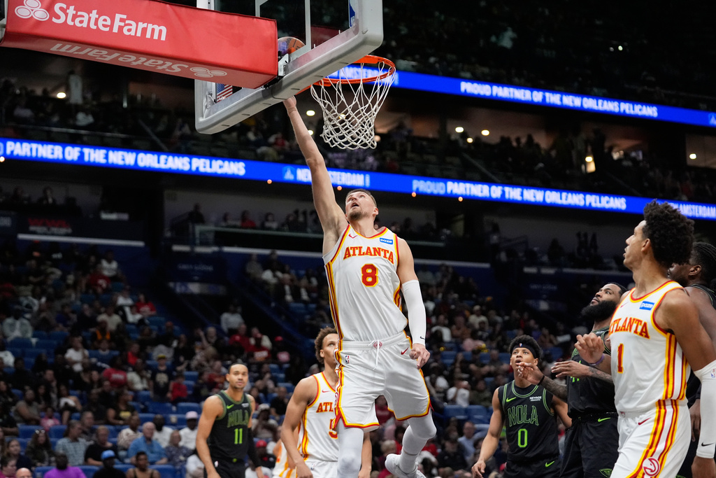 Atlanta Hawks center Kristaps Porzingis (8) goes to the basket against the New Orleans Pelicans in the second half of an NBA basketball game, Saturday, Nov. 22, 2025, in New Orleans. (AP Photo/Gerald Herbert)