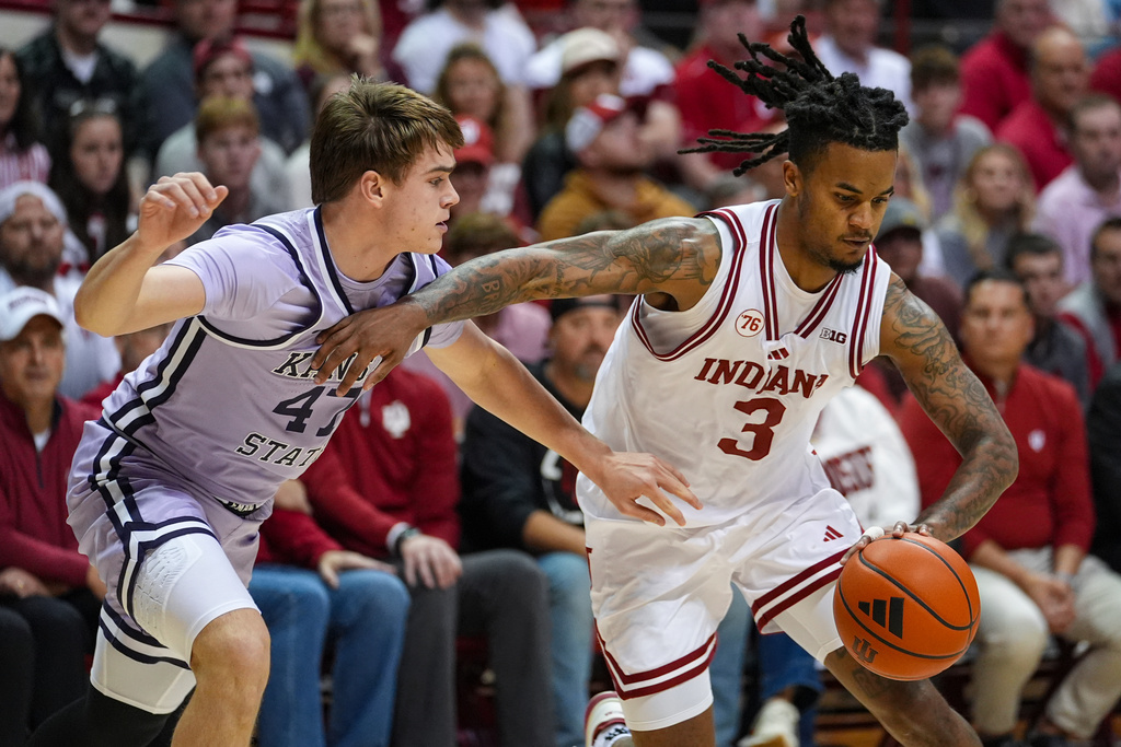 Indiana guard Lamar Wilkerson (3) drives on Kansas State guard Andrej Kostic (47) in the second half of an NCAA college basketball game in Bloomington, Ind., Tuesday, Nov. 25, 2025. (AP Photo/Michael Conroy)