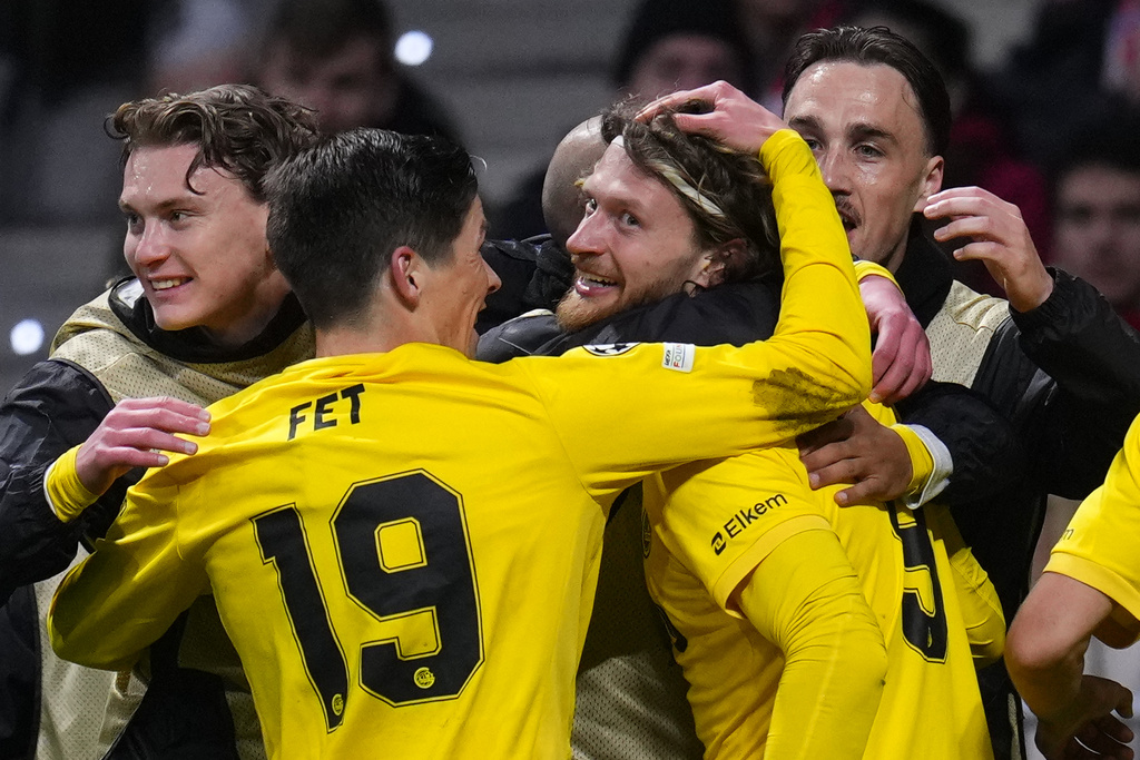 Glimt's Kasper Hogh, center, celebrates after scoring his side's second goal during the Champions League opening phase soccer match between Atletico Madrid and Bodo Glimt in Madrid, Spain, Wednesday, Jan. 28, 2026. (AP Photo/Manu Fernandez)