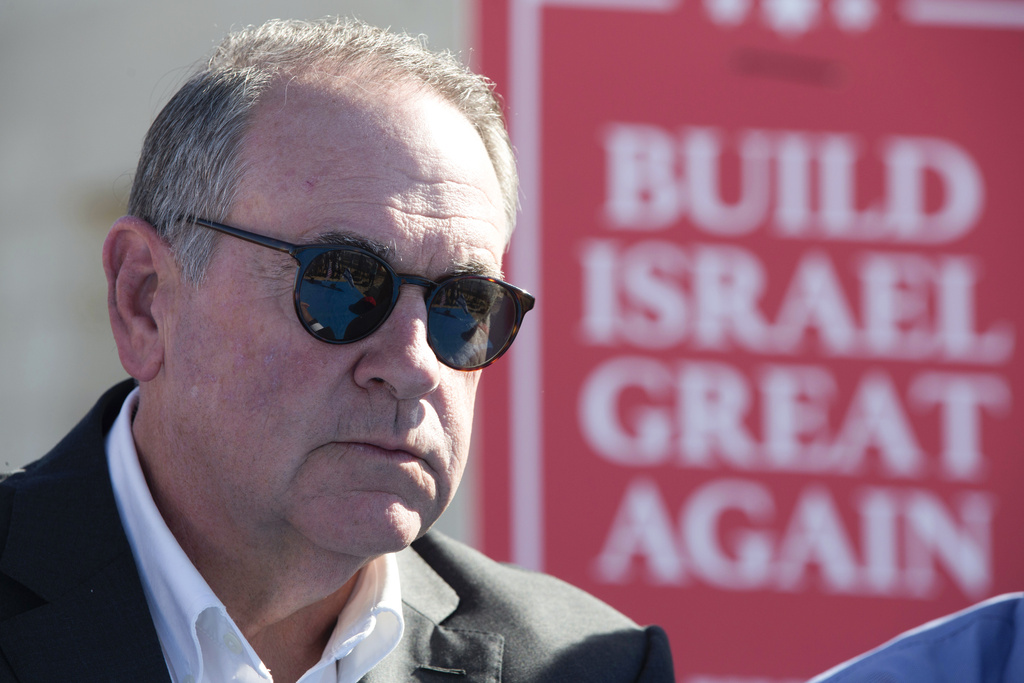 FILE - Gov. Mike Huckabee, R-Ark., takes questions from the media, prior to laying a brick at a new housing complex in the West Bank settlement of Efrat, Aug. 1, 2018. President-elect Donald Trump will nominate former Arkansas Gov. Mike Huckabee as ambassador to Israel. Trump said Tuesday that Huckabee is a staunch defender of Israel and his intended nomination comes as Trump has promised to align U.S. foreign policy more closely with Israel&rsquo;s interests as it wages wars against Hamas in Gaza and Hezbollah in Lebanon.(AP Photo/Oded Balilty, File)