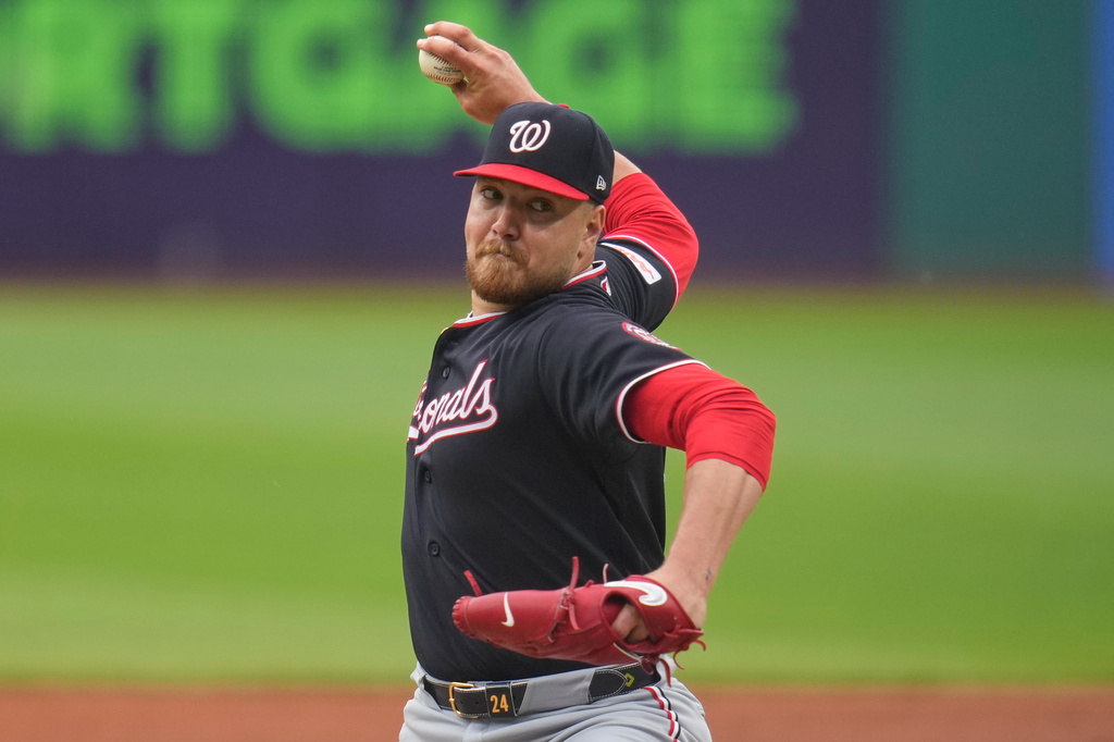 Washington Nationals' Cade Cavalli pitches in the first inning of a baseball game against the Cleveland Guardians in Cleveland, Tuesday, May 26, 2026. (AP Photo/Sue Ogrocki)