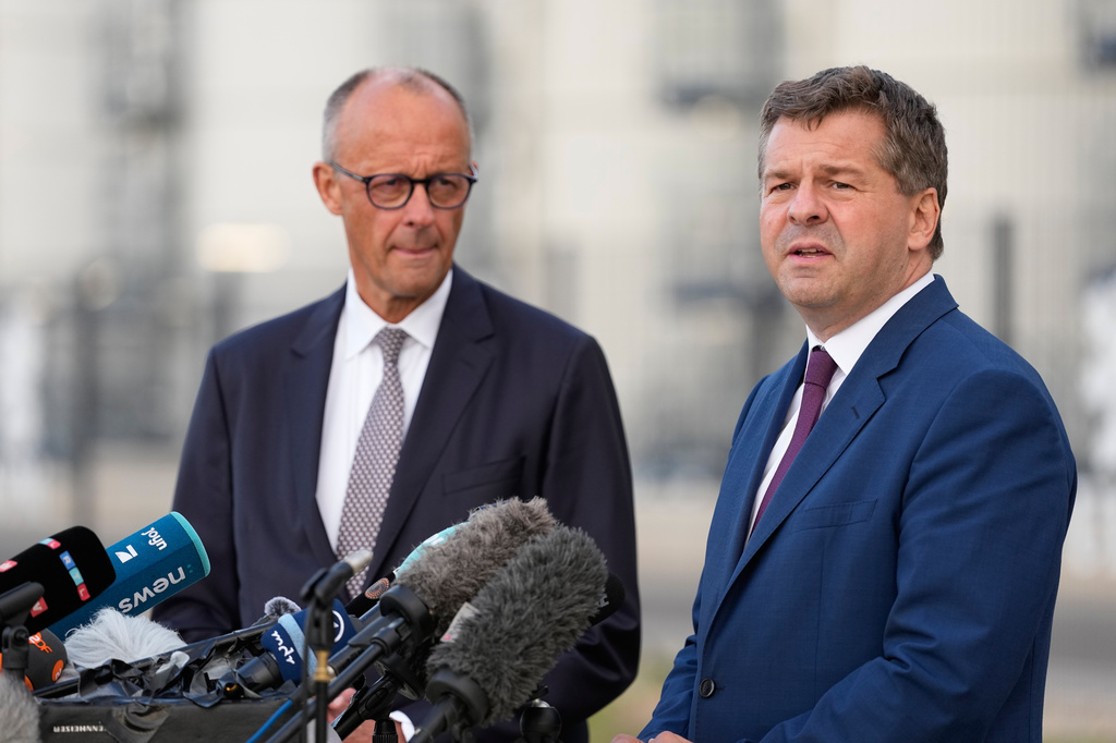 German Chancellor and Christian Democratic Union (CDU) party leader Friedrich Merz, left, and Saxony-Anhalt State Governor and top candidate Sven Schulze give a press statement after visiting UPM Biochemicals in Leuna, Germany, Thursday, Sept. 3, 2026. (AP Photo/Matthias Schrader)