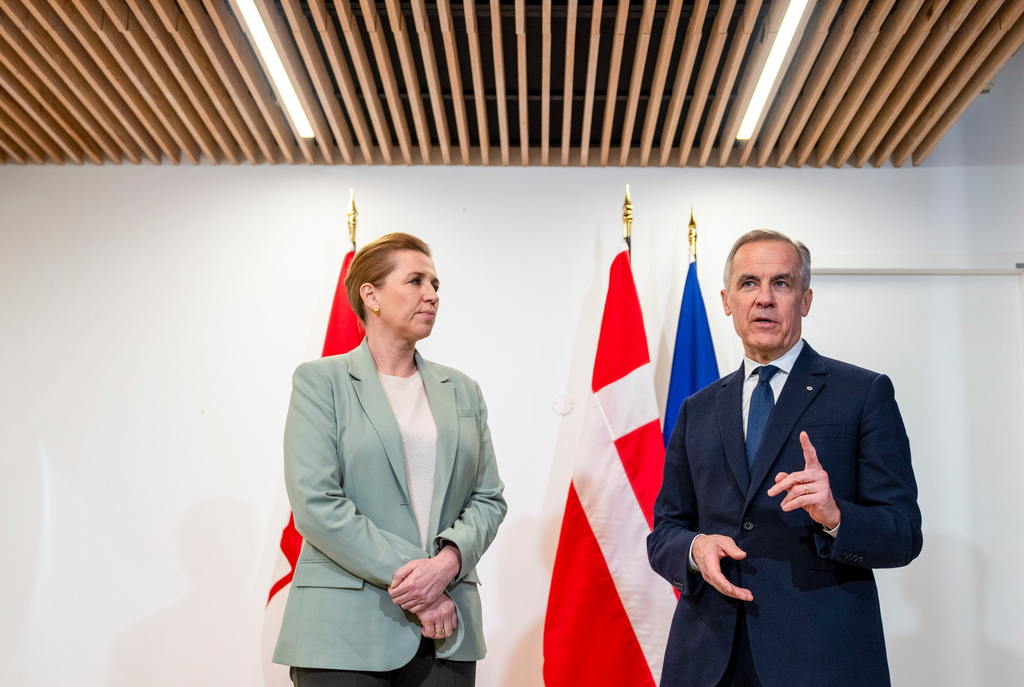 Canadian Prime Minister Mark Carney, right, takes part in a bilateral meeting with Prime Minister of Denmark Mette Frederiksen, at the Canadian Embassy in Paris, France, Tuesday, Jan. 6, 2026. (Christinne Muschi/The Canadian Press via AP)
