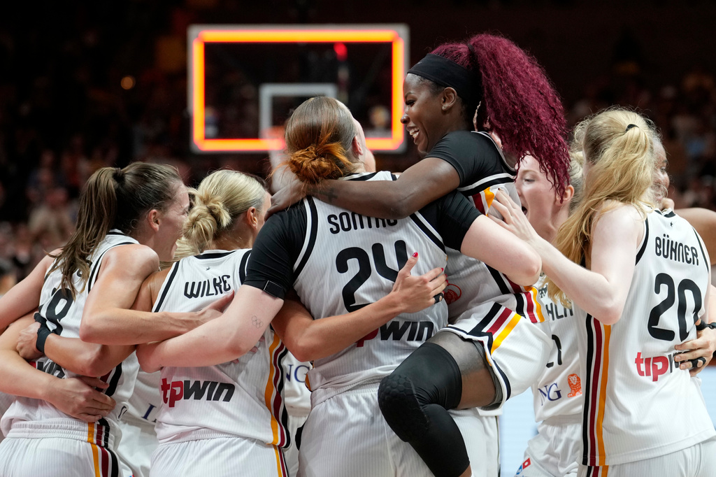 Germany players celebrate after the Women's Basketball World Cup qualification playoff between Germany and Korea in Berlin, Tuesday, Sept. 8, 2026. (AP Photo/Ebrahim Noroozi)